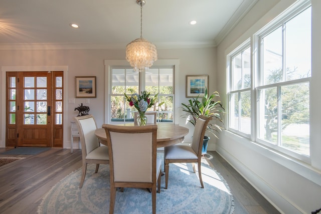 dining space with recessed lighting, crown molding, baseboards, dark wood finished floors, and an inviting chandelier