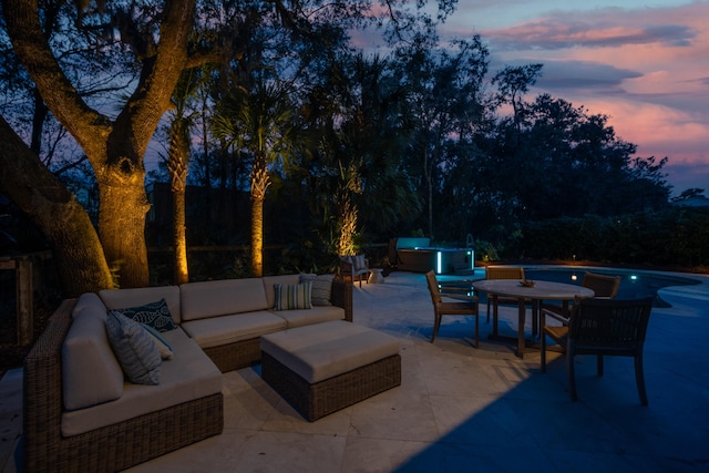 view of patio / terrace featuring an outdoor hangout area and a hot tub