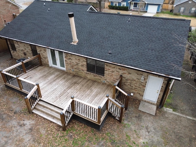 rear view of house with a wooden deck