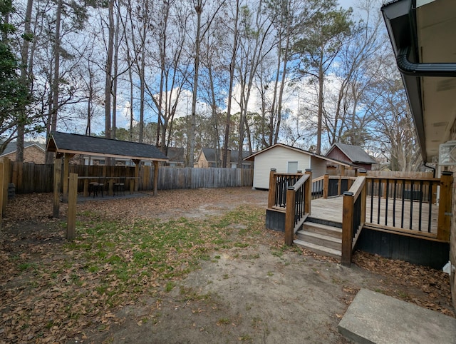 view of yard with a wooden deck