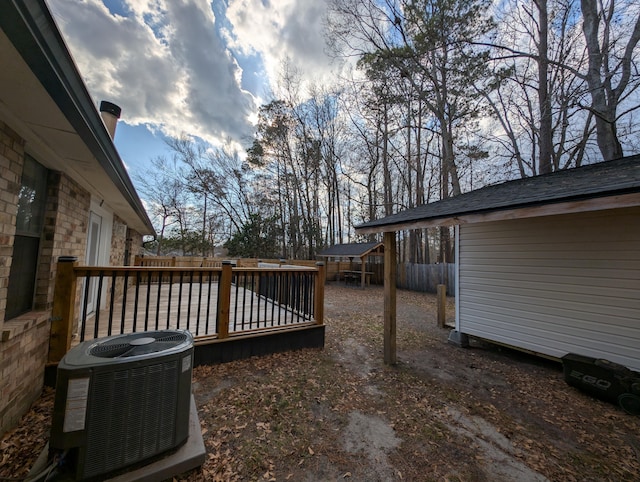 wooden deck with central air condition unit