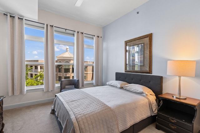 bedroom featuring a ceiling fan, baseboards, and carpet