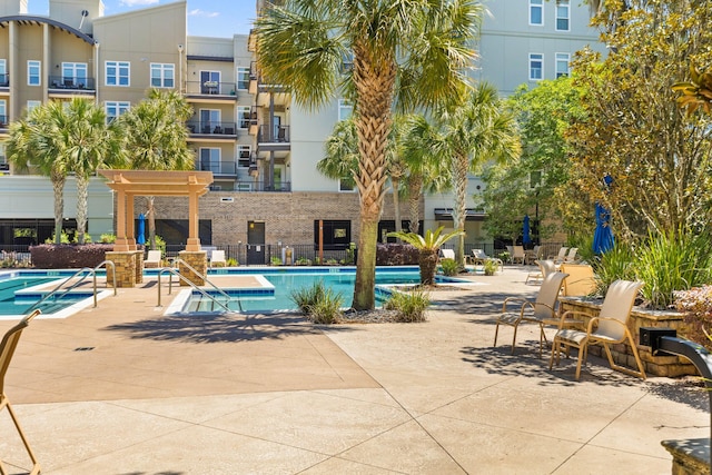 community pool with a patio area