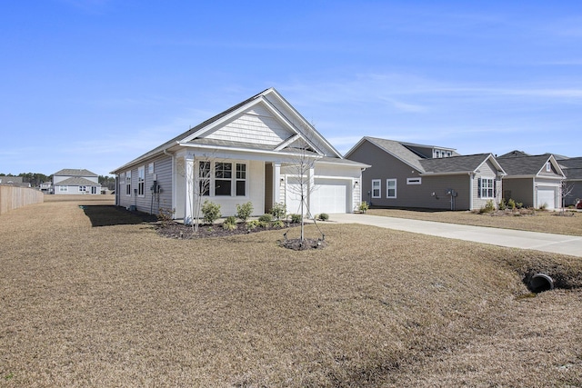 view of front facade featuring an attached garage, a residential view, and driveway