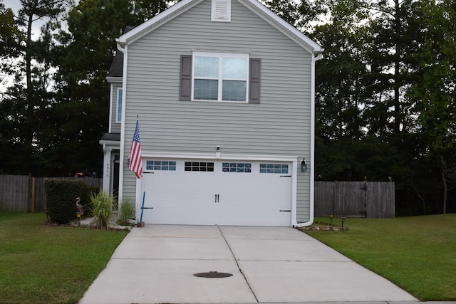 view of home's exterior with a yard and a garage