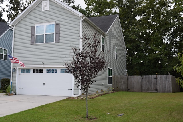 view of property exterior featuring a lawn and a garage