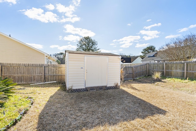 view of shed featuring a fenced backyard