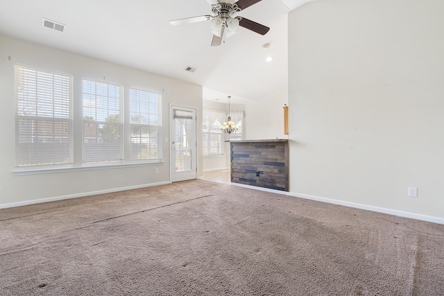 unfurnished living room with visible vents, ceiling fan with notable chandelier, baseboards, and carpet