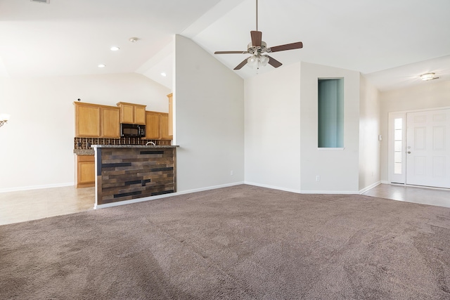 unfurnished living room with baseboards, light colored carpet, a ceiling fan, and lofted ceiling