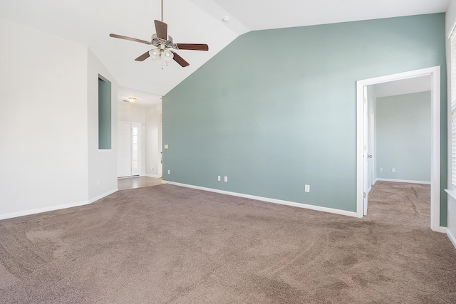 spare room with baseboards, carpet, ceiling fan, and high vaulted ceiling