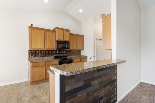 kitchen featuring visible vents, baseboards, tasteful backsplash, and black appliances