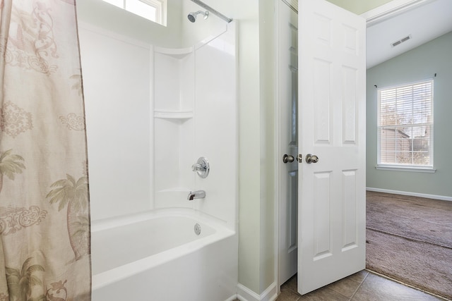 bathroom with visible vents, shower / tub combo with curtain, baseboards, tile patterned flooring, and lofted ceiling