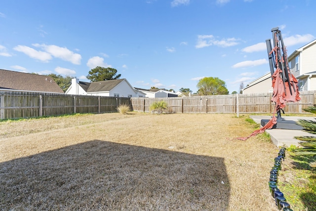 view of yard with a fenced backyard