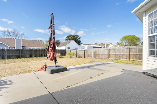 view of yard featuring a patio and a fenced backyard