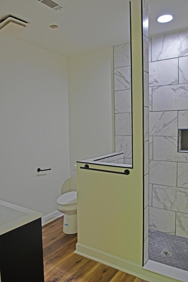 1101 Stuart Dr, Moncks Corner, SC 29461 - full bath with toilet, wood finished floors, tiled shower, recessed lighting, and vanity