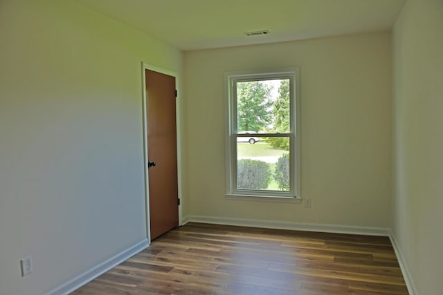 1101 Stuart Dr, Moncks Corner, SC 29461 - empty room featuring plenty of natural light, dark wood-style flooring, and baseboards