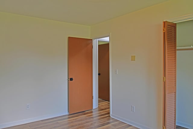1101 Stuart Dr, Moncks Corner, SC 29461 - unfurnished bedroom with a closet, wood finished floors, and baseboards