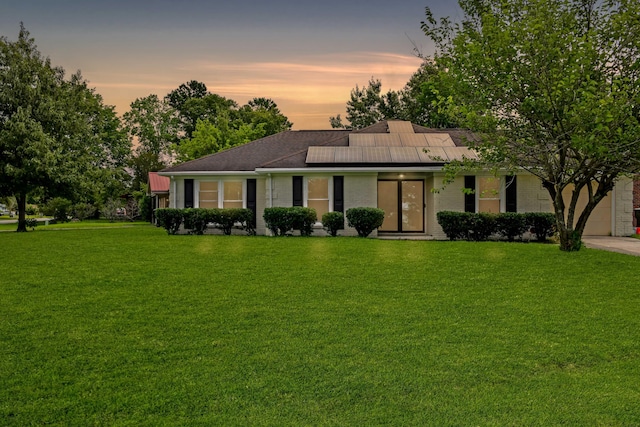 1101 Stuart Dr, Moncks Corner, SC 29461 - view of front of home featuring solar panels, a front lawn, and brick siding