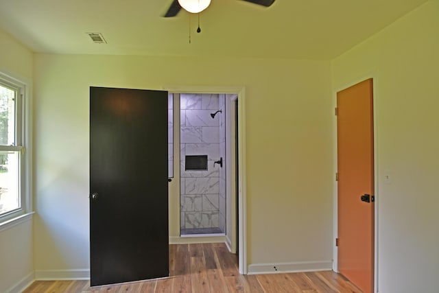1101 Stuart Dr, Moncks Corner, SC 29461 - unfurnished bedroom with wood finished floors, baseboards, and a ceiling fan