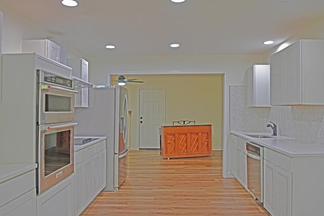 1101 Stuart Dr, Moncks Corner, SC 29461 - kitchen with a sink, stainless steel appliances, a ceiling fan, light wood-type flooring, and light countertops