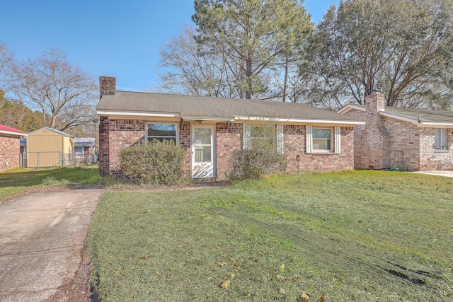 ranch-style home with a front lawn