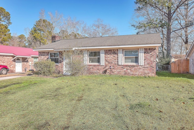 single story home with a front yard