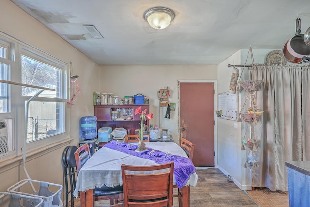 dining area featuring wood-type flooring