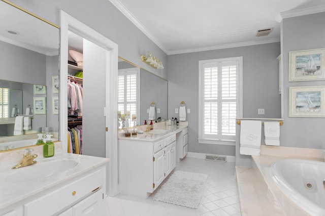 full bathroom featuring visible vents, ornamental molding, a whirlpool tub, and a sink