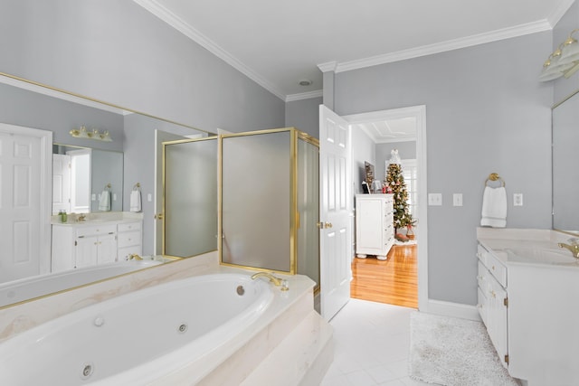 full bathroom with tile patterned flooring, a whirlpool tub, ornamental molding, a stall shower, and vanity