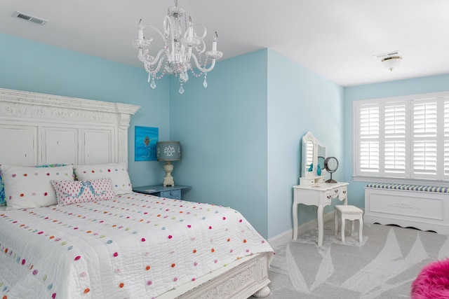 carpeted bedroom featuring visible vents, baseboards, and an inviting chandelier