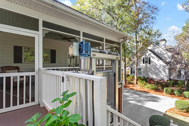 exterior space featuring a ceiling fan