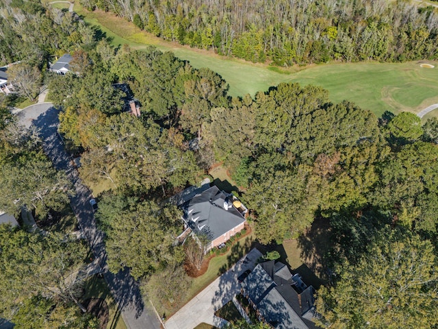 birds eye view of property with a view of trees