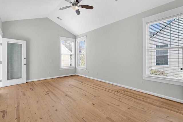 empty room with ceiling fan, lofted ceiling, visible vents, baseboards, and light wood-type flooring