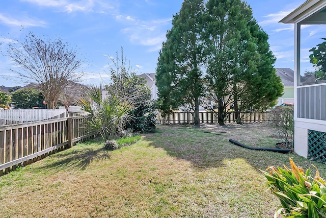 view of yard with a fenced backyard