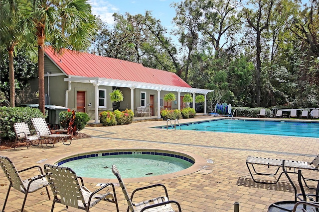 community pool featuring a patio, a community hot tub, a pergola, an outdoor structure, and a storage structure