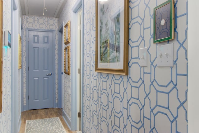 10 Teaneck Rd, Goose Creek, SC 29445 - hallway with wallpapered walls, attic access, wood finished floors, and ornamental molding