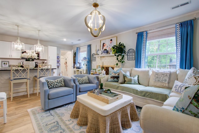10 Teaneck Rd, Goose Creek, SC 29445 - living room with a chandelier, light wood-type flooring, recessed lighting, and ornamental molding