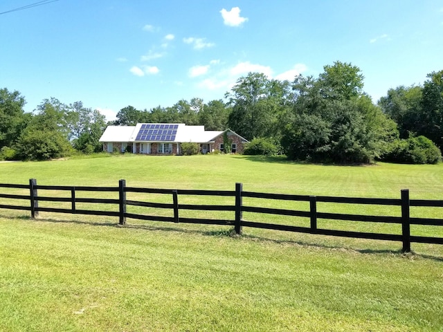 view of yard with a rural view