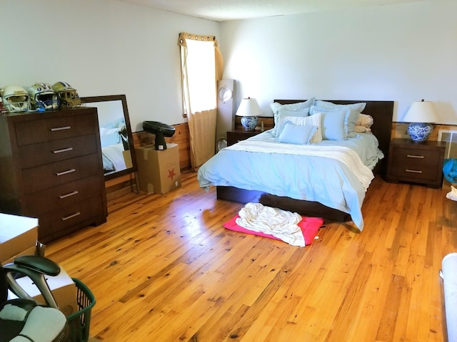 bedroom with light hardwood / wood-style floors