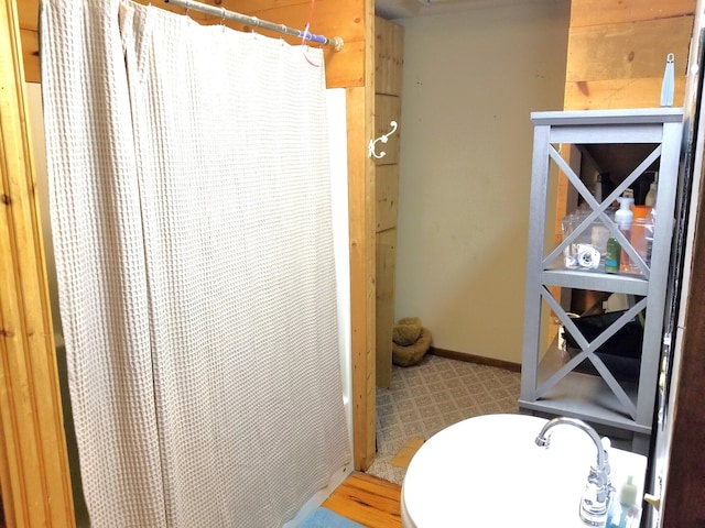 bathroom with sink, toilet, a shower with shower curtain, and tile patterned floors