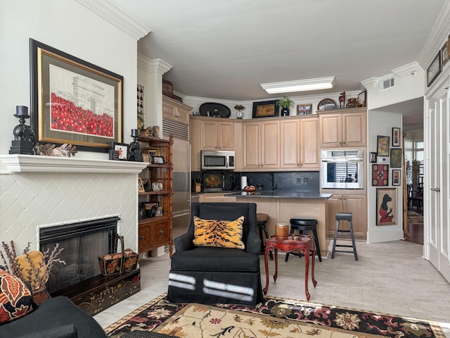 living room with crown molding and a fireplace