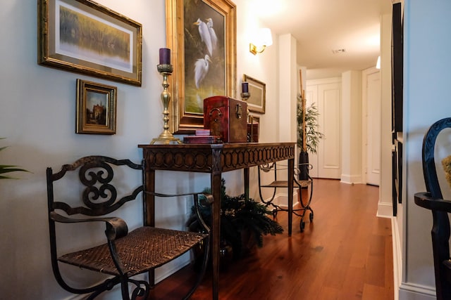 hallway with hardwood / wood-style flooring