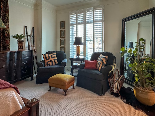 sitting room with light colored carpet and ornamental molding