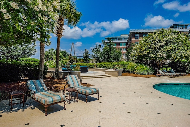 view of swimming pool featuring a patio area