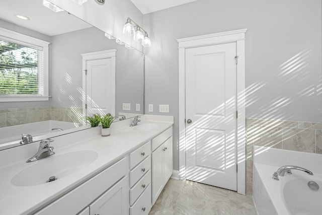 full bath featuring a bath and double vanity