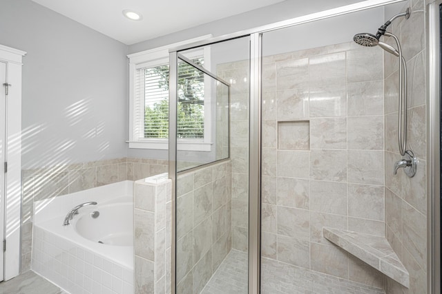 full bath with a garden tub and a stall shower