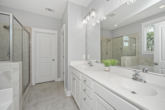 full bath featuring a stall shower, a garden tub, double vanity, and baseboards