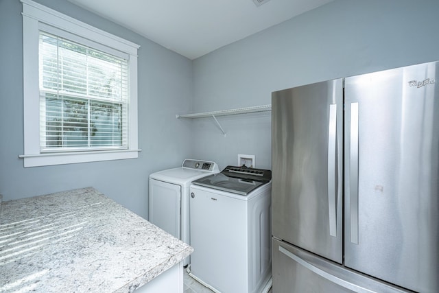 clothes washing area featuring washing machine and dryer