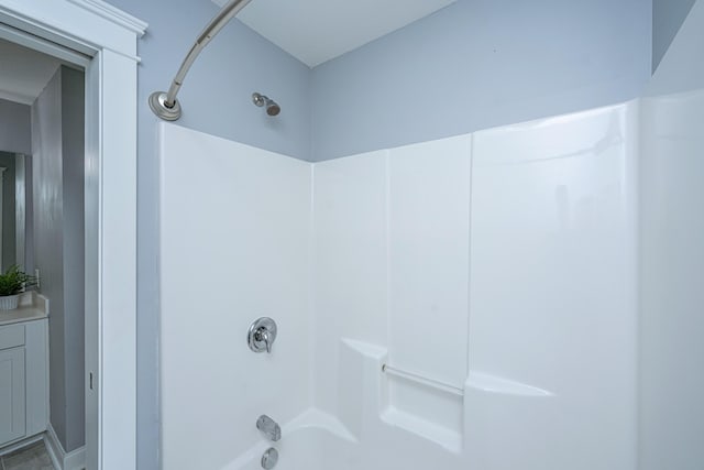 bathroom with bathing tub / shower combination and vanity