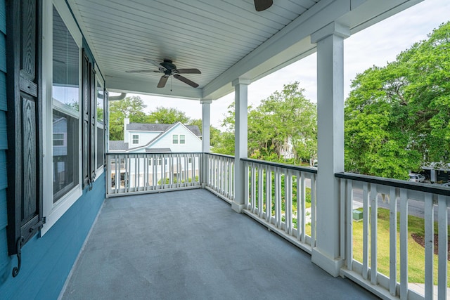 balcony featuring ceiling fan and a porch